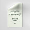 White card with 'Welcome to Event Name Date' text on a gray background